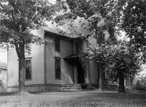 Exterior view of their two-story clapboard home