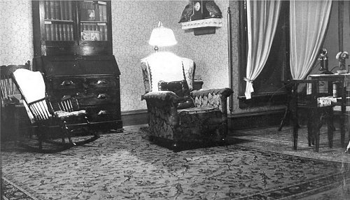 Another interior view with antique furniture and telephone